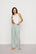 Model is wearing Nautico Boxer Pant in Regatta Stripe Seagrass/White
