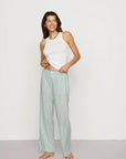 Model is wearing Nautico Boxer Pant in Regatta Stripe Seagrass/White