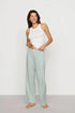 Model is wearing Nautico Boxer Pant in Regatta Stripe Seagrass/White