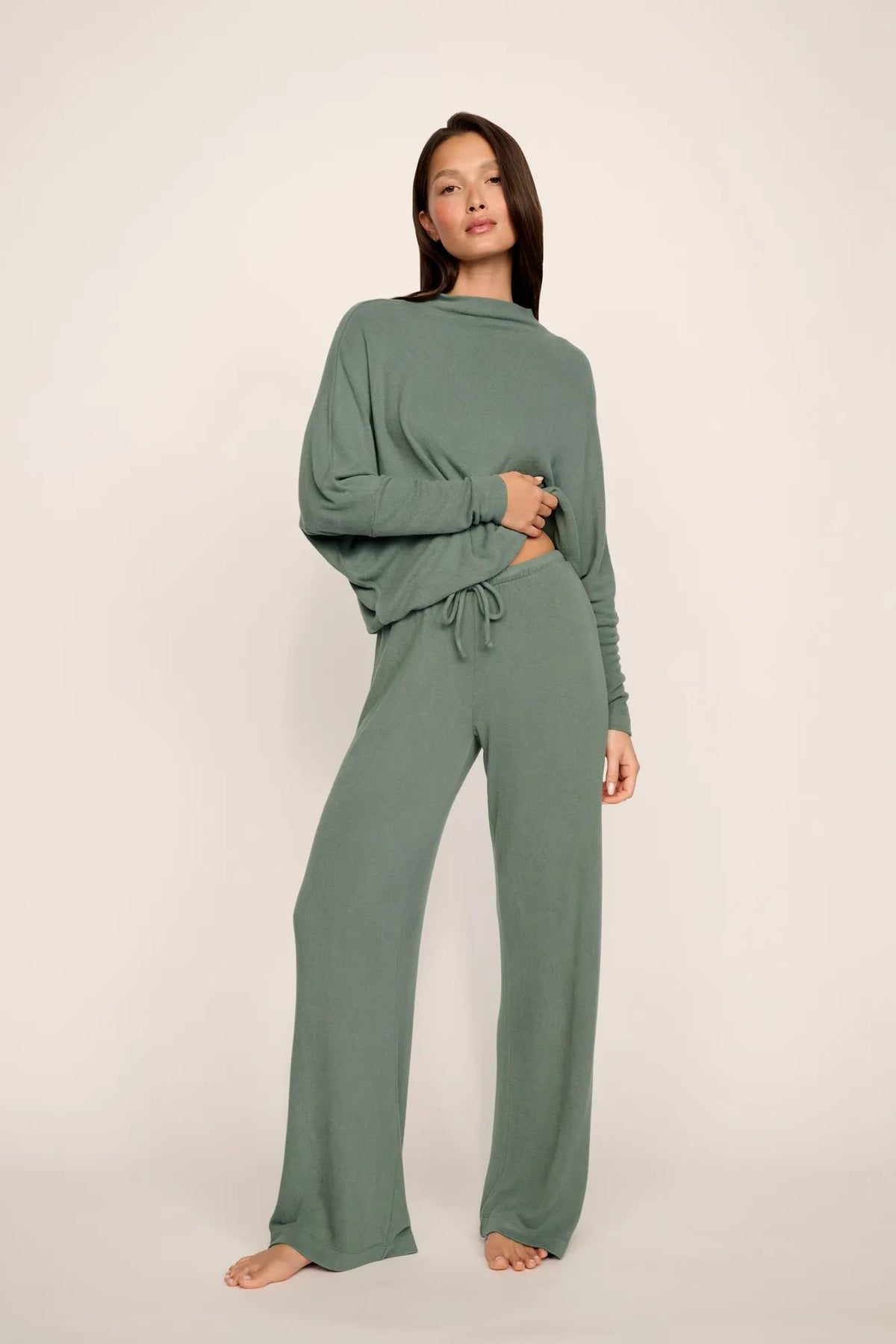 Model is wearing Cozy Time Pant in Desert Sage
