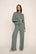 Model is wearing Cozy Time Pant in Desert Sage