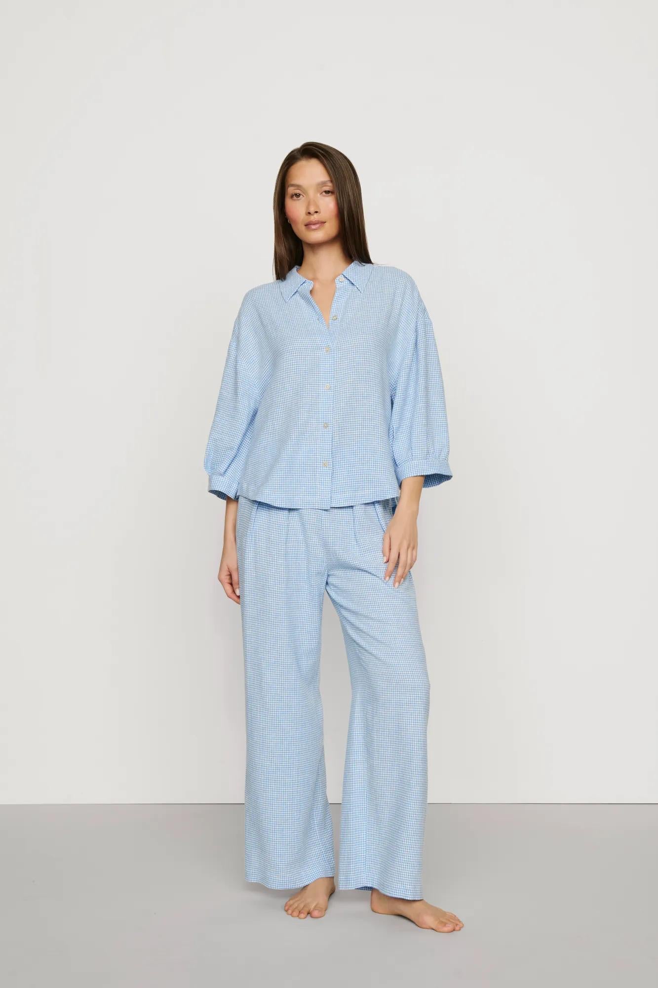 Model is wearing Linen Blend Relaxed Quarter Sleeve Top in Gingham White/Summer Blue