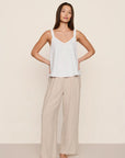 Model is wearing Linen Blend Relaxed Pant in Gingham White/Warm Taupe