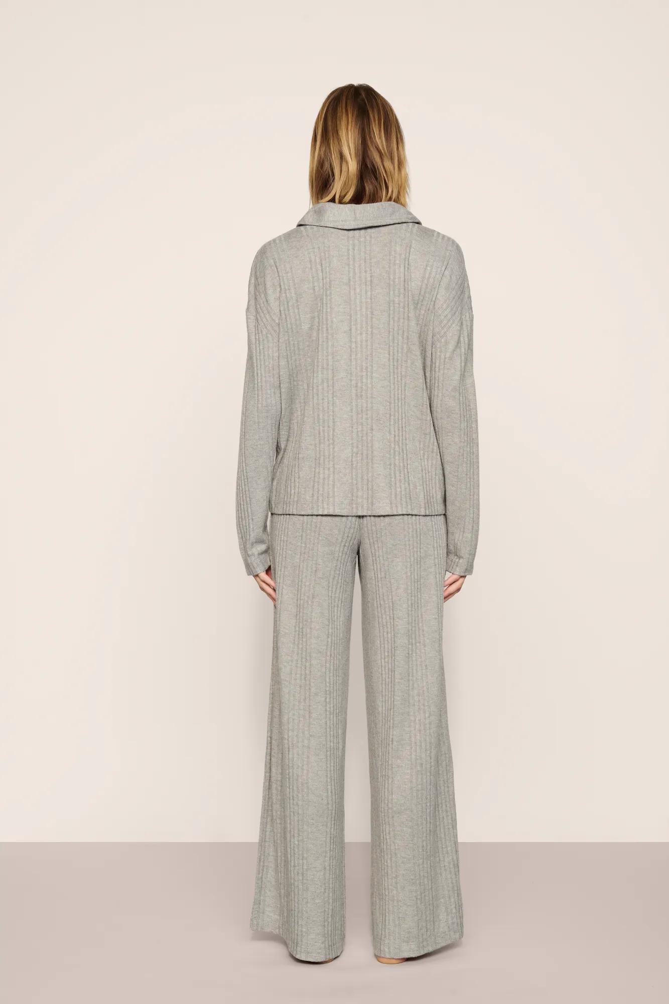 Model is wearing Variegated Rib Long Sleeve Polo in Dark Heather Grey