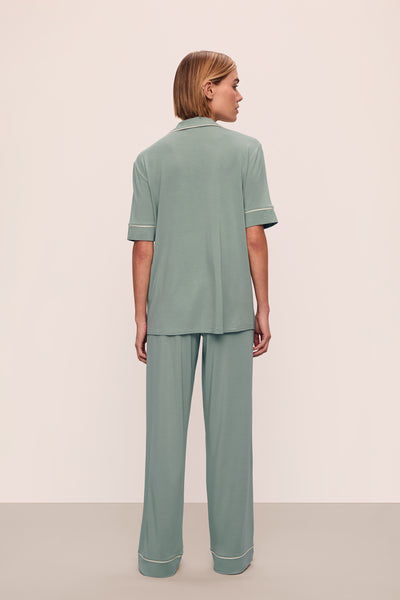 Model is wearing Gisele TENCEL™ Modal Short Sleeve & Pant PJ Set in Eucalyptus/Ivory