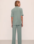 Model is wearing Gisele TENCEL™ Modal Short Sleeve & Pant PJ Set in Eucalyptus/Ivory