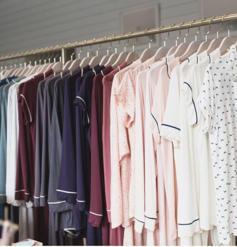pajamas and loungewear hanging on a clothes rack