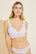 Model wears Mariana Bralette in white.