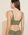 Model wears Naya Longline Bralette in Olive. 