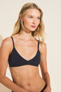 Model wears Pima Stretch Cotton Bralette in Black.