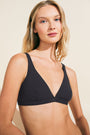 Model wears Pima Stretch Cotton V Bralette in Black.