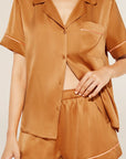 Model wears Inez Washable Silk Short PJ Set in Caramel/Bright Orange.