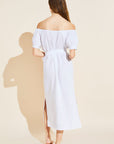 Model wears Harper Linen Dress in white.