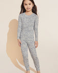 Model wears Kids Printed TENCEL™ Modal Unisex Long PJ Set in Animale Coastal Blue.