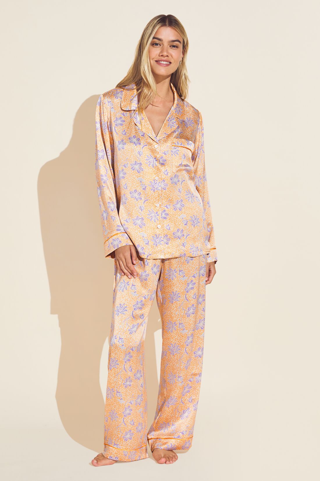 Model wears Inez Washable Silk Printed Long PJ Set in Blossom Bright Orange/Bright Orange.