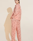 Model wears Organic Sandwashed Cotton Printed Long PJ Set in Animal Spot Rose Cloud.