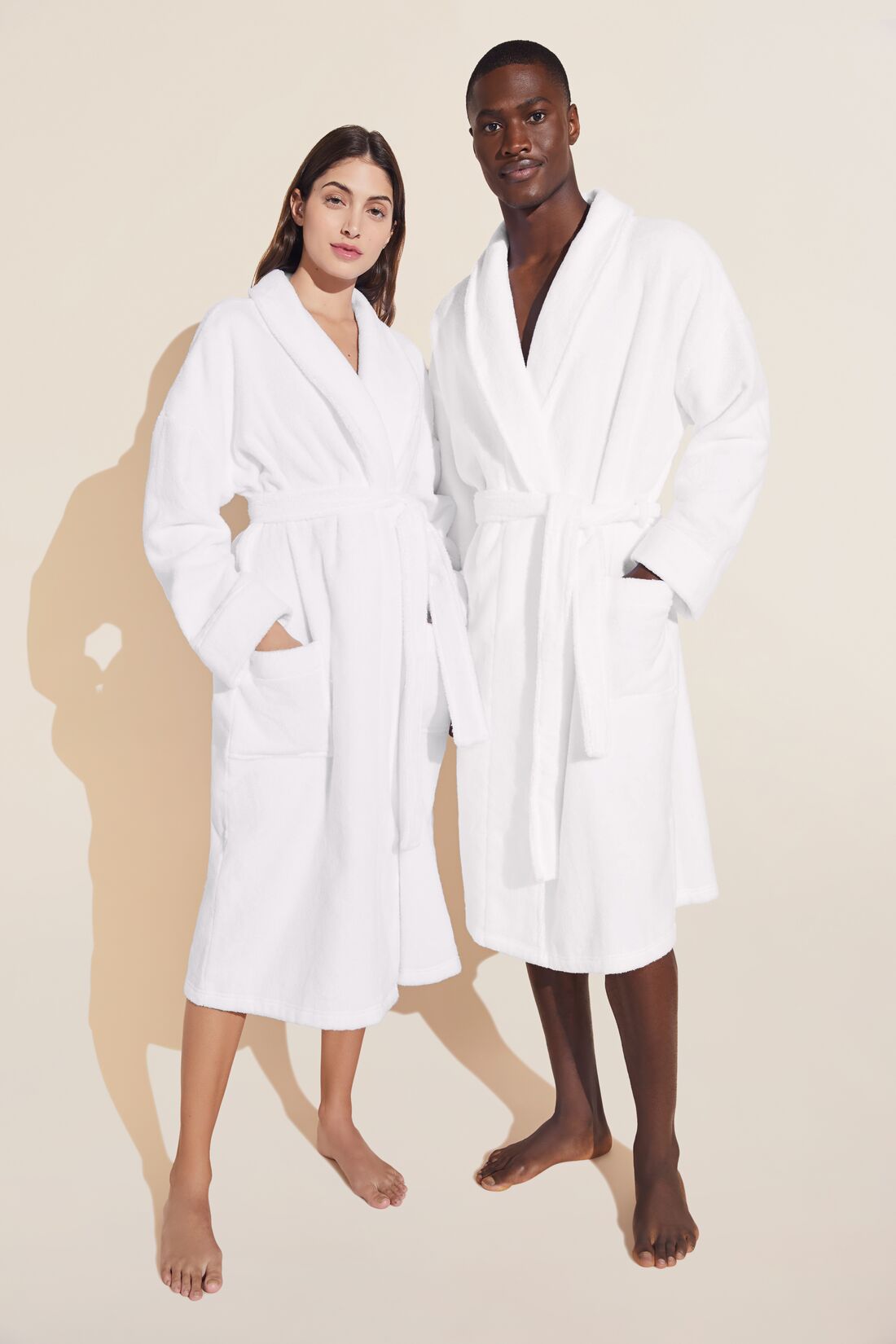 Model wears Terry Gender Neutral Robe in White.