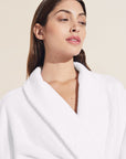 Model wears Terry Gender Neutral Robe in White.