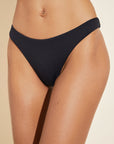 Model wears Dree Smooth Bikini Bottom in Black.