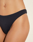 Model wears Dree Smooth Bikini Bottom in Black.