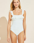 Model wears Jane Smooth One-Piece in Ecru.