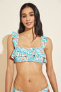 Model wears Jane Textured Bikini Top in tropical print.