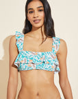 Model wears Jane Textured Bikini Top in tropical print.