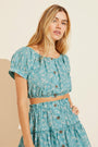 Model wears Harper Organic Cotton Voile Beach Top in tropical print.